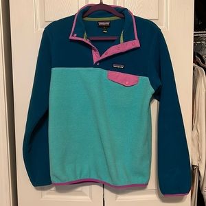 Lightly worn. Size medium but fits like a small. Snug fit.